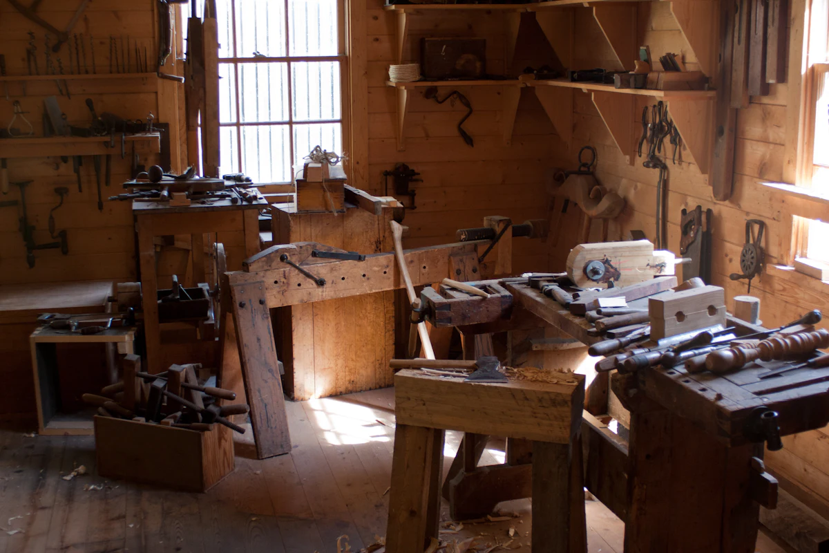 The Portland workshop bench: offcuts, jigs and a sorting tray of finished maze walls.